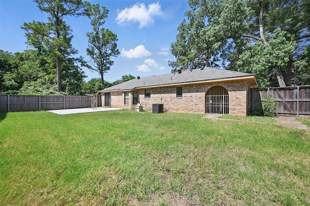 2701 Mims St, Fort Worth, TX 76112 - back of property with a patio area, central air condition unit, and brick siding