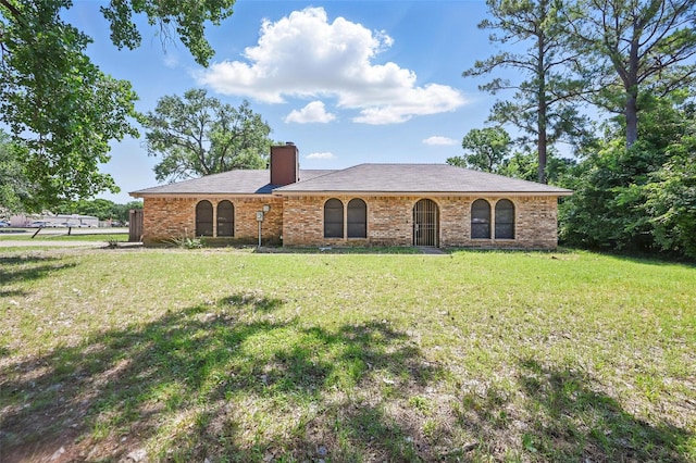 2701 Mims St, Fort Worth, TX 76112 - single story home featuring a front lawn, a chimney, and brick siding