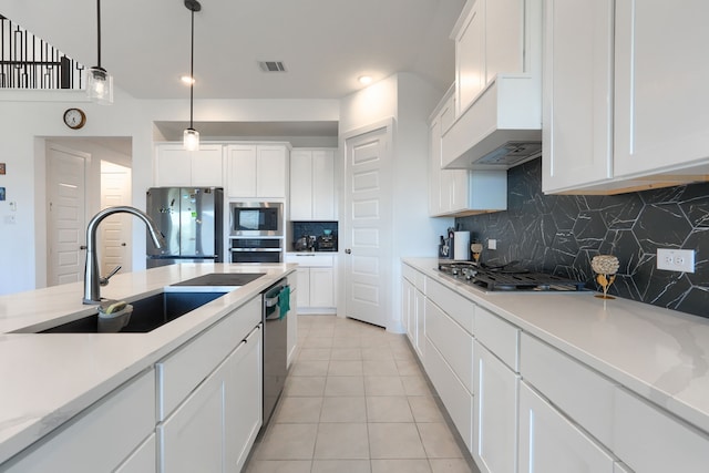 108 Laverna Ln, Hickory Creek, TX 75065 - kitchen with a sink, stainless steel appliances, custom exhaust hood, decorative backsplash, and white cabinetry