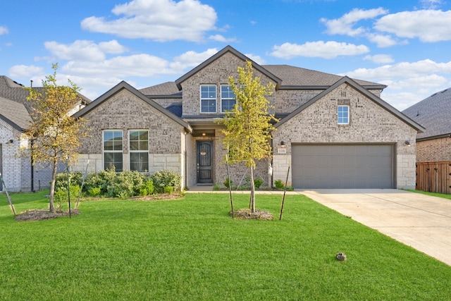 108 Laverna Ln, Hickory Creek, TX 75065 - view of front of home with concrete driveway, a front lawn, brick siding, and a garage