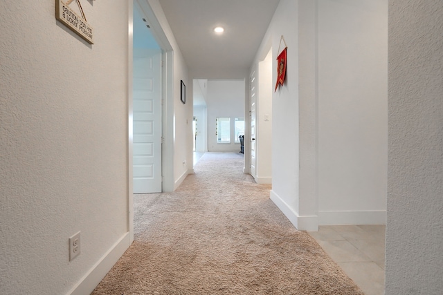 108 Laverna Ln, Hickory Creek, TX 75065 - hallway with a textured wall, light colored carpet, and baseboards