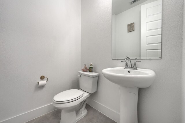 108 Laverna Ln, Hickory Creek, TX 75065 - half bath with tile patterned flooring, baseboards, toilet, and a sink