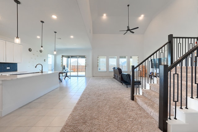 108 Laverna Ln, Hickory Creek, TX 75065 - unfurnished living room with light tile patterned floors, ceiling fan, a towering ceiling, recessed lighting, and a sink