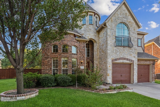 5736 New Castle Dr, Richardson, TX 75082 - view of front facade featuring an attached garage, concrete driveway, stone siding, and roof with shingles