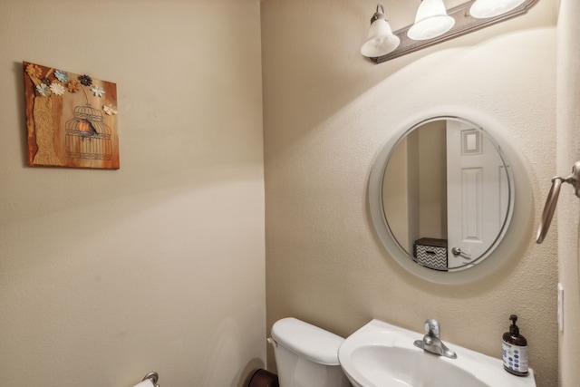 5736 New Castle Dr, Richardson, TX 75082 - bathroom with toilet and a sink