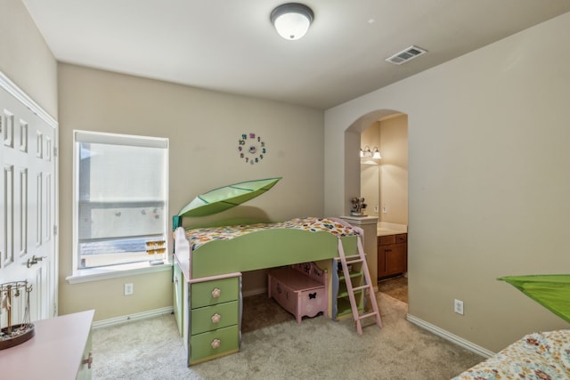 5736 New Castle Dr, Richardson, TX 75082 - bedroom with arched walkways, light colored carpet, and baseboards