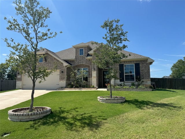 101 Aberdeen Dr, Anna, TX 75409 - view of front of home featuring driveway, brick siding, a shingled roof, and stone siding