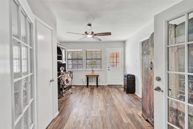 1603 Versailles Dr, Richardson, TX 75081 - office with wood finished floors, ceiling fan, and baseboards