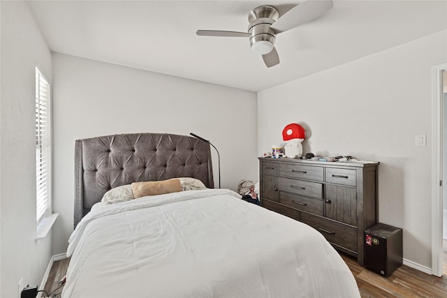 1603 Versailles Dr, Richardson, TX 75081 - bedroom with wood finished floors, baseboards, and a ceiling fan