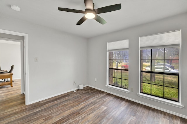 1603 Versailles Dr, Richardson, TX 75081 - spare room with wood finished floors, baseboards, and ceiling fan