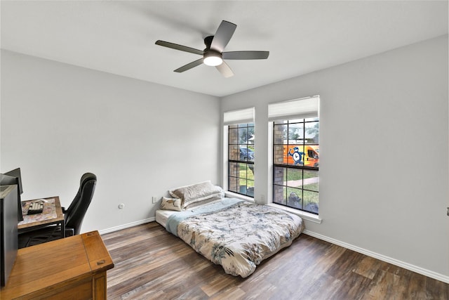 1603 Versailles Dr, Richardson, TX 75081 - bedroom with wood finished floors, baseboards, an office area, and a ceiling fan