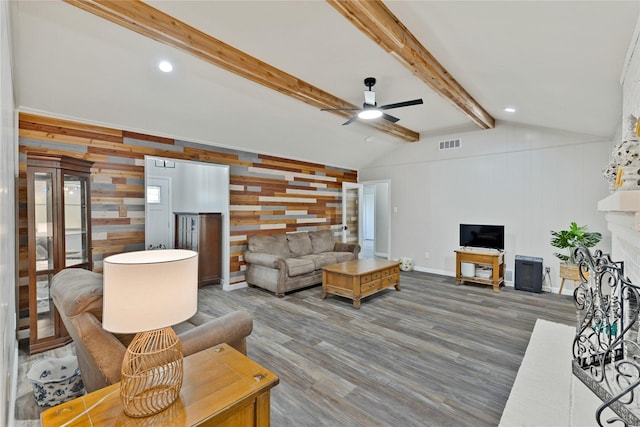 1603 Versailles Dr, Richardson, TX 75081 - living room with a ceiling fan, wood walls, wood finished floors, a brick fireplace, and baseboards