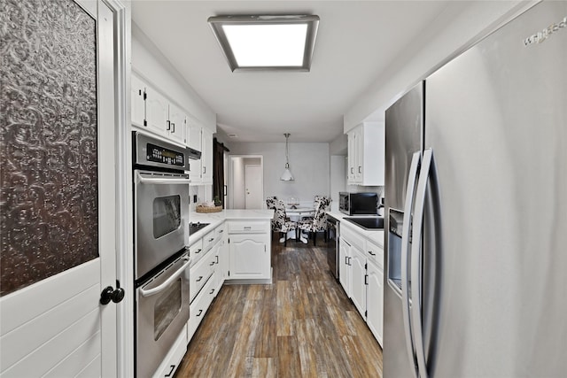 1603 Versailles Dr, Richardson, TX 75081 - kitchen with stainless steel appliances, white cabinets, dark wood-style floors, and light countertops
