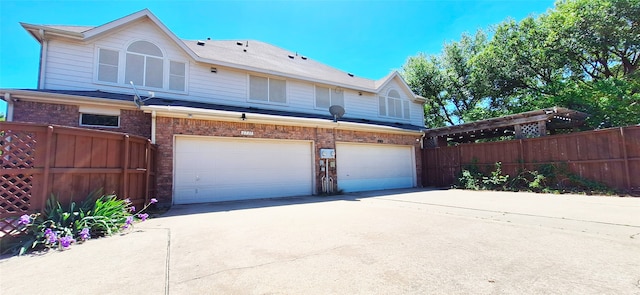 6731 Canterbury Dr, Frisco, TX 75035 - view of front of house with a garage, concrete driveway, and brick siding