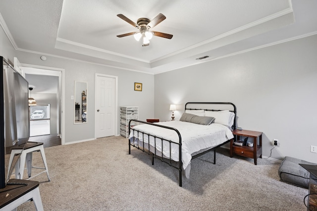 223 Mccarley Pl, Mckinney, TX 75071 - bedroom featuring a raised ceiling, carpet, ornamental molding, baseboards, and ceiling fan