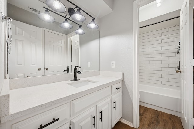 223 Mccarley Pl, Mckinney, TX 75071 - bathroom featuring vanity, wood finished floors, and  shower combination