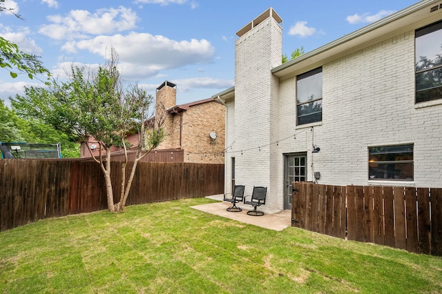 223 Mccarley Pl, Mckinney, TX 75071 - rear view of property with a chimney, a patio, and brick siding