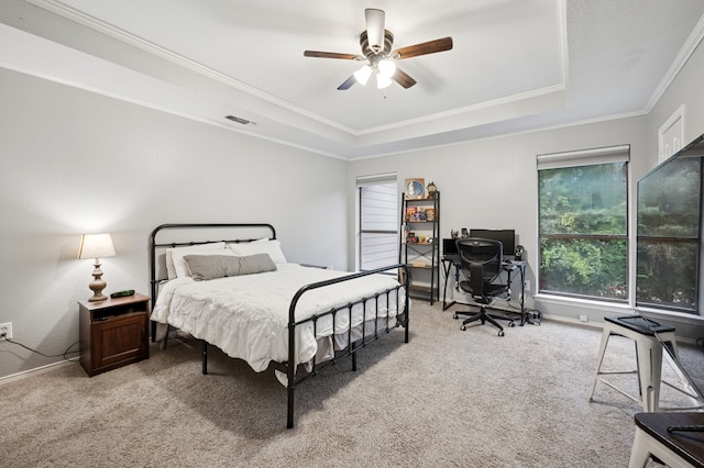 223 Mccarley Pl, Mckinney, TX 75071 - carpeted bedroom with a tray ceiling, crown molding, a desk, ceiling fan, and baseboards