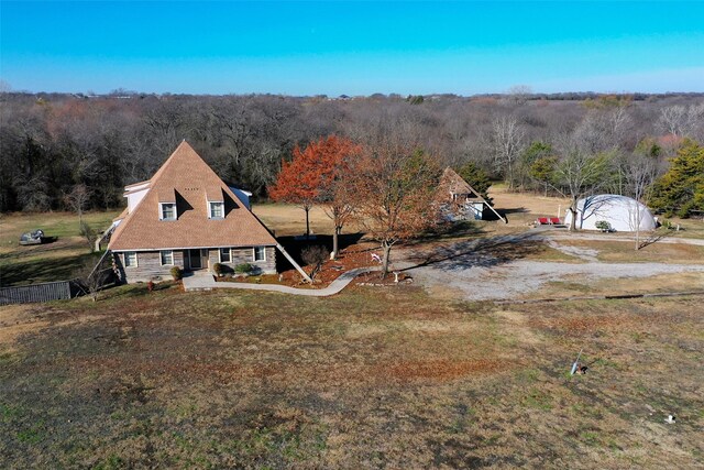 691 Bear Rd, Van Alstyne, TX 75495 - view of front of property featuring a wooded view and a front yard