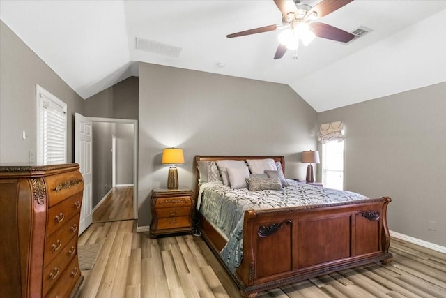 810 W Lonesome Dove Trl, Arlington, TX 76001 - bedroom with lofted ceiling, light wood finished floors, baseboards, and a ceiling fan