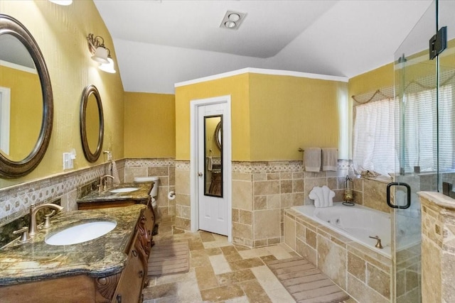 810 W Lonesome Dove Trl, Arlington, TX 76001 - full bathroom with vaulted ceiling, tile walls, a garden tub, double vanity, and a stall shower