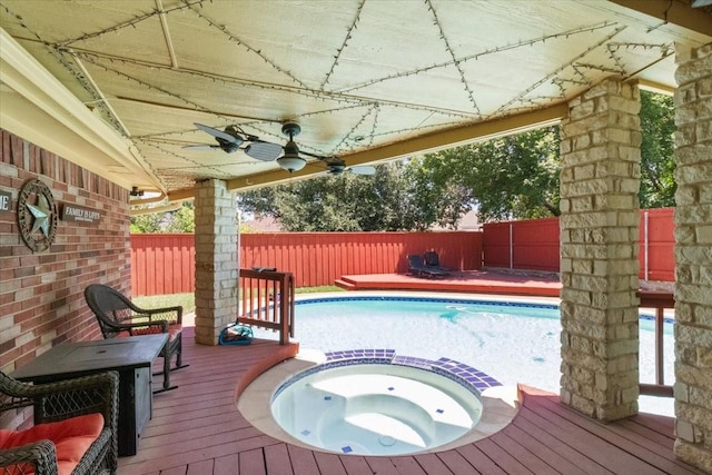 810 W Lonesome Dove Trl, Arlington, TX 76001 - view of pool featuring a wooden deck, a fenced backyard, ceiling fan, and a pool with connected hot tub