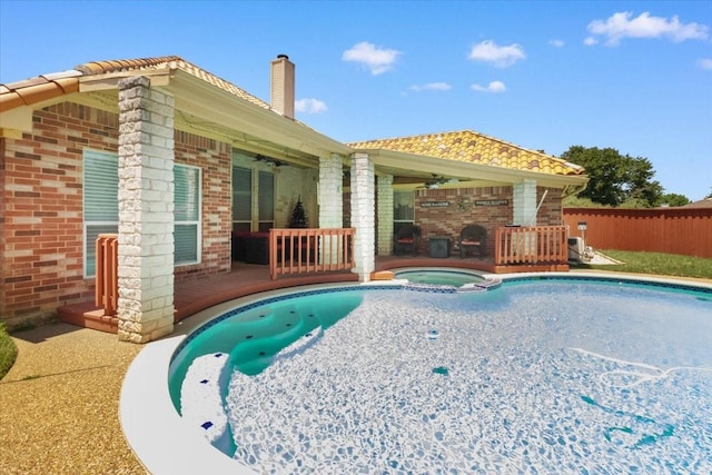 810 W Lonesome Dove Trl, Arlington, TX 76001 - view of swimming pool featuring ceiling fan, a pool with connected hot tub, and a patio