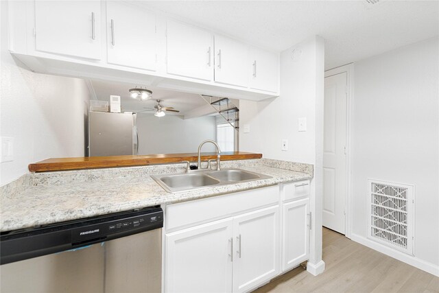 3121 Park Ln Unit 1146, Dallas, TX 75220 - kitchen with dishwasher, a sink, light wood-style flooring, a ceiling fan, and light countertops