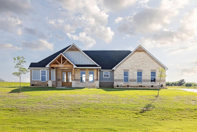 10611 Millet Ln, Venus, TX 76084 - craftsman-style home featuring french doors, board and batten siding, a front lawn, and stone siding
