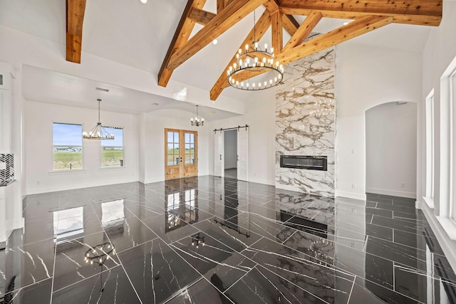 10611 Millet Ln, Venus, TX 76084 - living area with high vaulted ceiling, a chandelier, plenty of natural light, beam ceiling, and french doors