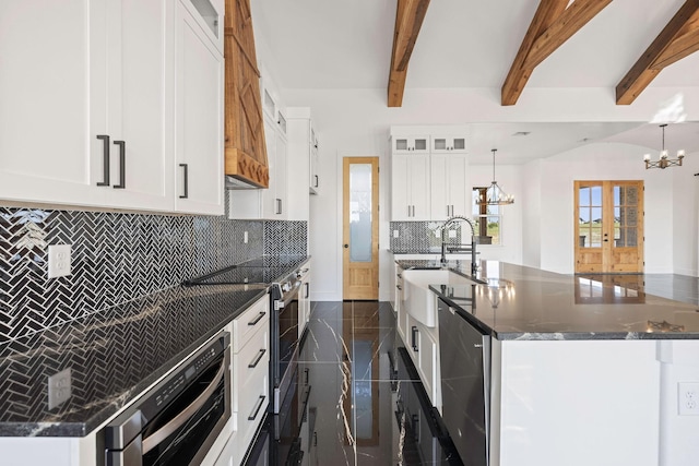 10611 Millet Ln, Venus, TX 76084 - kitchen featuring a chandelier, decorative backsplash, a sink, a kitchen island with sink, and beam ceiling