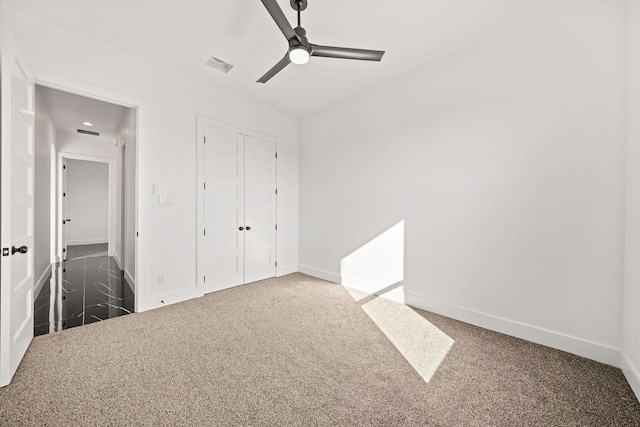 10611 Millet Ln, Venus, TX 76084 - unfurnished bedroom with baseboards, carpet floors, a closet, and ceiling fan