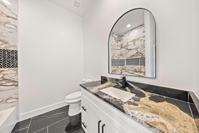 10611 Millet Ln, Venus, TX 76084 - bathroom featuring marble look tiles, vanity, toilet, and baseboards