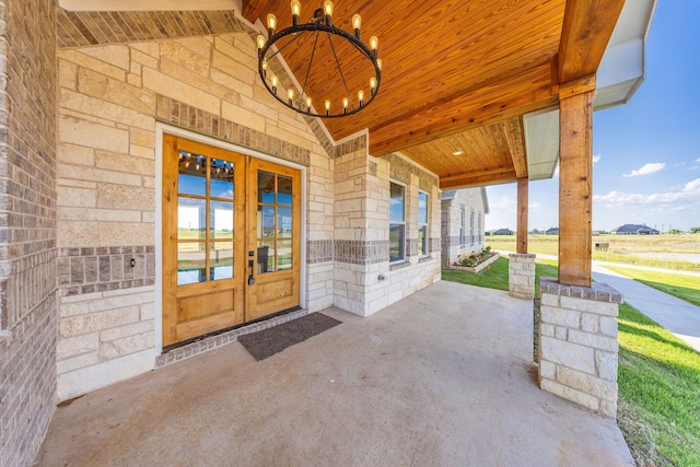 10611 Millet Ln, Venus, TX 76084 - entrance to property with stone siding, french doors, and a porch