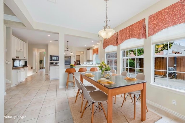 6720 Grant Ln, Plano, TX 75024 - dining area with light tile patterned flooring, baseboards, recessed lighting, and a chandelier