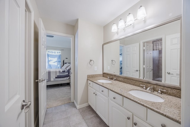 6720 Grant Ln, Plano, TX 75024 - full bathroom with ensuite bath, double vanity, tile patterned flooring, and baseboards