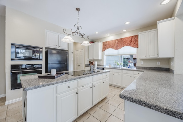 6720 Grant Ln, Plano, TX 75024 - kitchen with black appliances, a center island, white cabinets, light tile patterned floors, and recessed lighting
