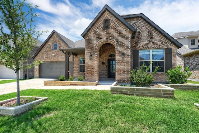 1733 Ann St, Celina, TX 75009 - view of front of house featuring brick siding, a garage, driveway, and a front lawn