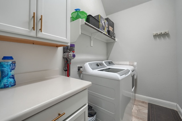 1733 Ann St, Celina, TX 75009 - laundry room featuring washing machine and dryer, cabinet space, baseboards, and light wood-style floors
