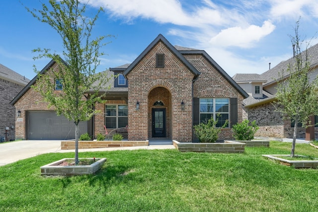 1733 Ann St, Celina, TX 75009 - view of front of home featuring brick siding, driveway, and a front yard