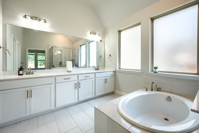 1733 Ann St, Celina, TX 75009 - full bathroom featuring lofted ceiling, double vanity, a garden tub, and a stall shower