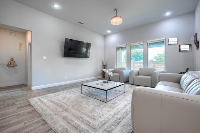 1733 Ann St, Celina, TX 75009 - living area featuring light wood finished floors, baseboards, and recessed lighting