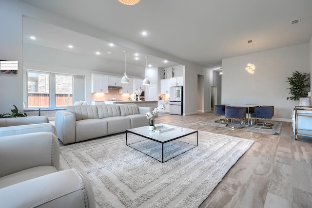 1733 Ann St, Celina, TX 75009 - living area with light wood-type flooring, baseboards, and recessed lighting