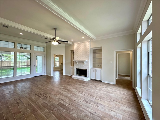 2105 Sandhurst St, Bossier City, LA 71111 - unfurnished living room with ornamental molding, a ceiling fan, a fireplace, baseboards, and wood finished floors