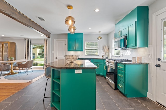 5308 Parkland Ave, Dallas, TX 75235 - kitchen with appliances with stainless steel finishes, open shelves, healthy amount of natural light, a center island, and recessed lighting