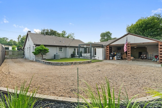 5308 Parkland Ave, Dallas, TX 75235 - back of property with central AC unit, a patio, brick siding, and roof with shingles