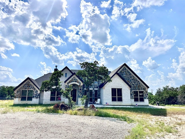 180 Cant Miss, Gordon, TX 76453 - french country inspired facade featuring stone siding and brick siding
