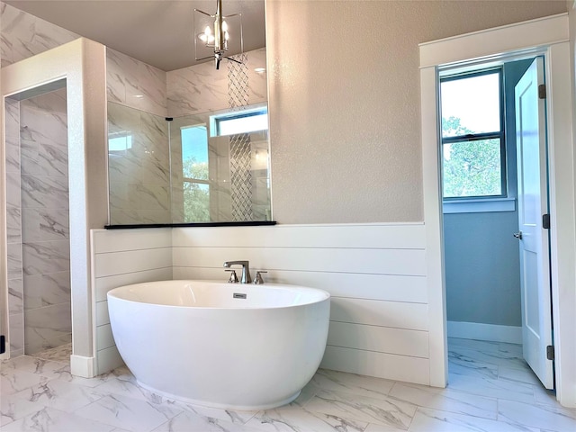 180 Cant Miss, Gordon, TX 76453 - bathroom with marble look tile flooring, a marble finish shower, a soaking tub, and wainscoting
