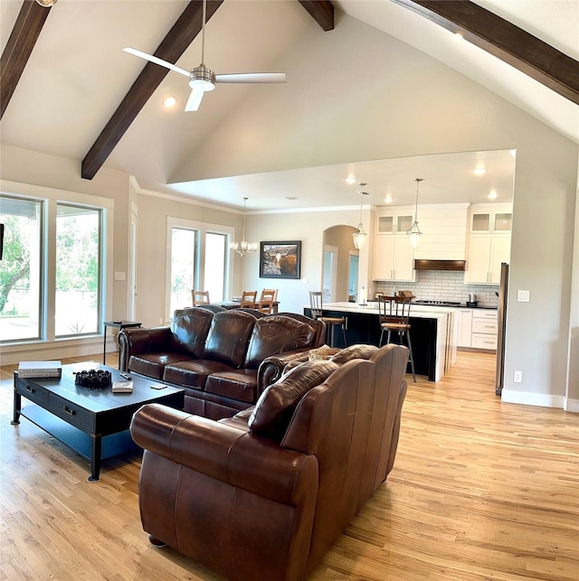 180 Cant Miss, Gordon, TX 76453 - living room with light wood-type flooring, beam ceiling, recessed lighting, ceiling fan, and arched walkways