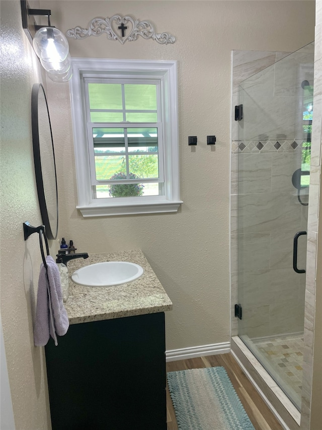 2620 County Road 1102, Grandview, TX 76050 - full bath with vanity, a stall shower, and wood finished floors